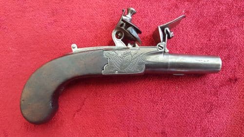 A good English Flintlock boxlock miniature muff pistol by Holmes. Concealed drop down trigger. Circa 1800. Good condition. Ref 9531.