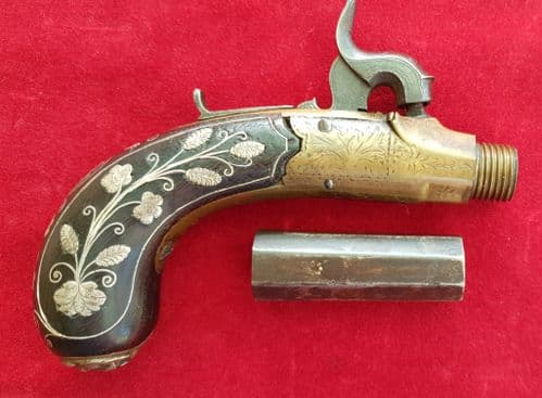 A good English single barrelled percussion pocket pistol inlaid with silver wire decoration.Ref 2540