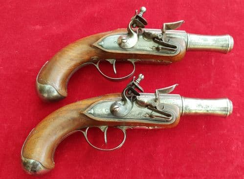 A pair of French flintlock canon barrelled pistols, engraved  Delety A Paris. Circa 1770. Ref 2705