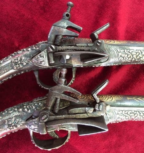 A pair of Greek Miquelet pistols. Solid stocks covered with silver decoration, for sale, Ref 9000.