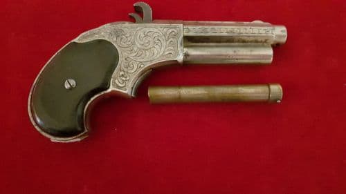 A rare factory engraved Remington Rider .32 rim-fire magazine pistol C.1871. Good condition.Ref 2613