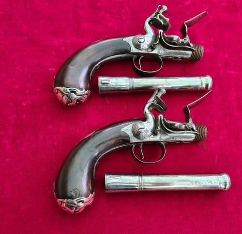 A rare pair of English Queen Anne silver mounted flintlock pistols by HAWKINS of LONDON.  Ref 3731.
