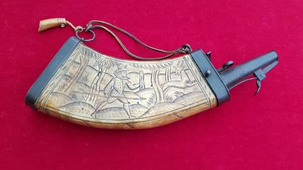 A rare wheel-Lock period powder horn engraved with a hunting scene of figure and Deer. Ref 8528.