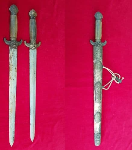 A scarce Chinese sword with two blades in scabbard, mounts are embossed with a dragon. Ref 1795
