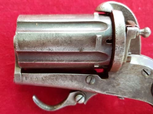 A scarce English 6 shot 7mm pin-fire pepper-box revolver. Circa 1865. Ref 1878.