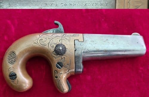 A scarce Moore's patent Derringer in .41 rim-fire with a brass frame. C.1860-1865. Ref 3257