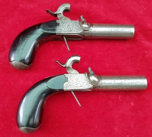 A scarce pair of Belgian Percussion pocket pistols, with screw-off barrels. Circa 1840. Ref 1630.