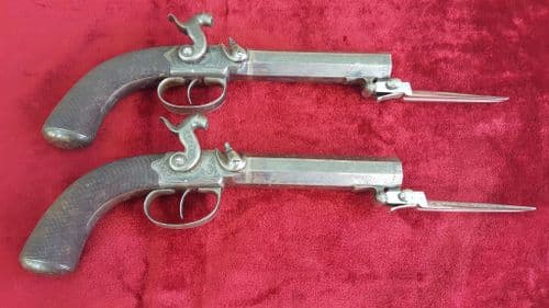 A Scarce Pair of percussion travelling pistols fitted with spring bayonets by G & J DEANE LONDON. Circa 1835-1850. Ref 9405.