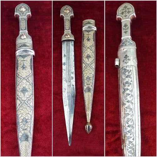 A very fine silver Kindjal the hilt and scabbard covered in nielloed silver. Etched blade. Good condition. Ref 9411.