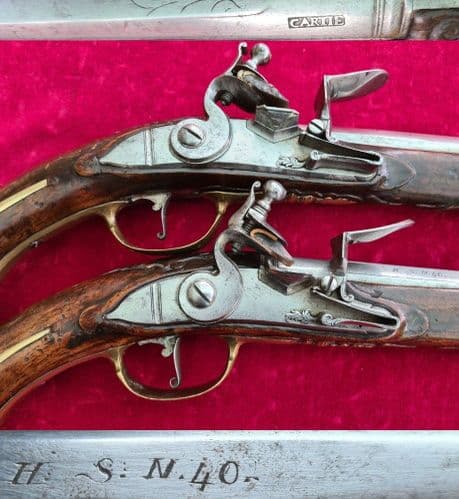 A very long pair of high quality brass mounted  flintlock pistols. Circa 1720-1740.  Ref 3781.