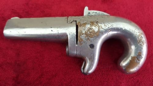American Moores patent .41 rimfire Derringer. Bronze nickel plated frame with engraved decoration. Ref 8408.