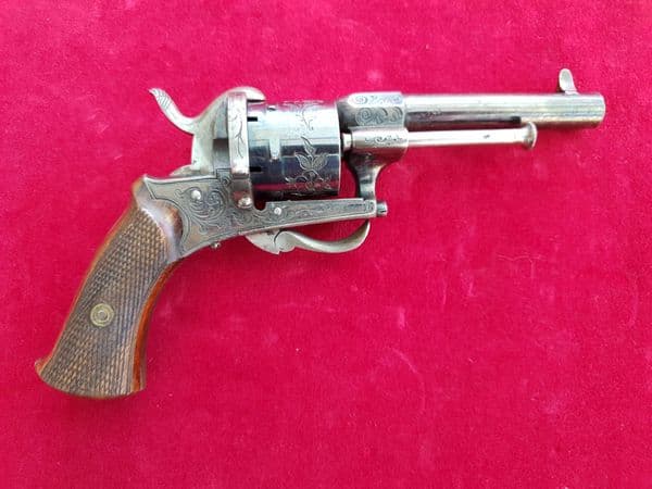 An exceptional engraved  7mm 6 shot pinfire revolver with lots of original blued finish. Ref 1919.