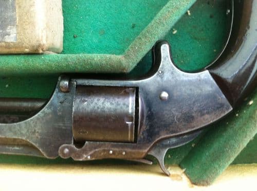 X X X  SOLD X X X   A Smith & Wesson rIimfire revolver in leather case. Ref 5817.