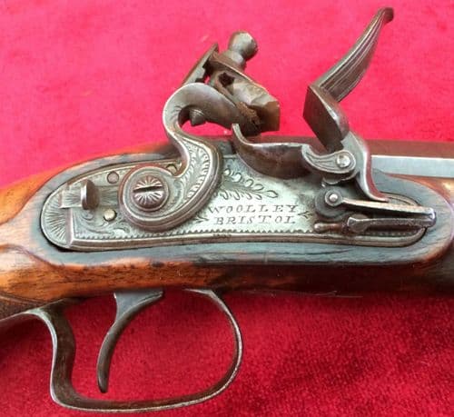 XXX SOLD XXX A scarce Napoleonic era Flintlock Pistol by Woolley of Bristol. Octagonal barrel, Captive Ramrod. Good condition. Ref 8224.